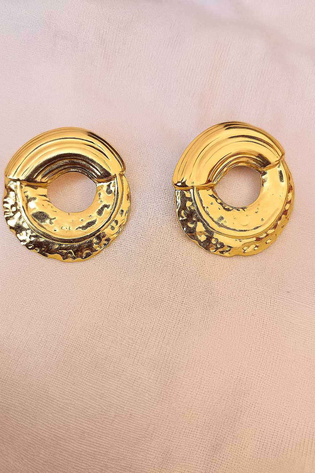 Round large stud earring in polished gold finish featuring a textured, open circular design, perfect for adding a bold statement to any luxury accessories collection.